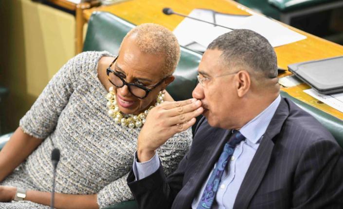 Prime Minister Dr Andrew Holness in dialogue with Fayval Williams, minister of finance and the public service, during Opposition Leader Mark Golding’s (not pictured) 2026-2027 Budget Debate presentation in the House of Representatives on Tuesday. 