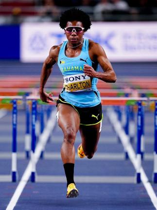 Devynne Charlton powers towards her third World Athletics Championships 60-metre hurdles title, clocking 7.65 seconds inside the Kujawsko-Pomorska Arena in Torun, Poland, on Sunday. 