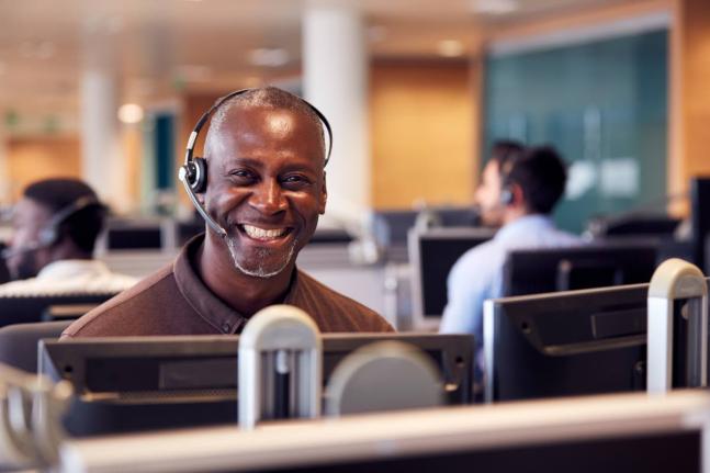 Representational image of a customer service executive interacting with a customer over the phone.