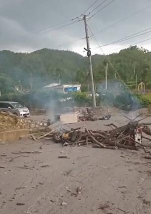 More than 100 residents of Troy, Trelawny, took to the streets on Wednesday, demanding the release of a man arrested in connection with Tuesday's mob killing 