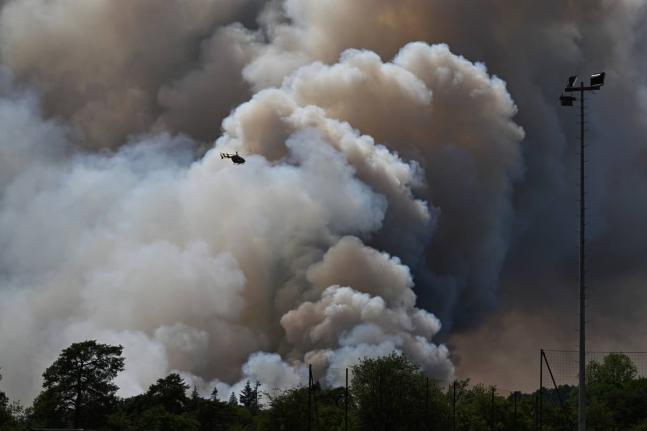 A pyrocumulonimbus, or pyroCb – a giant cloud created by a large wildfire – is seen in the Fontainebleau forest region, about 60 kilometers (37 miles) south of Paris, France. – AP photo