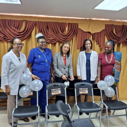 Jamalco’s Manager, Corporate Communications and Public Relations, Donna Marie Brooks (third from left), presents donated chairs to the Accident and Emergency (A&E) Department of the May Pen Hospital, to representatives of the May Pen Hospital. Pictured f