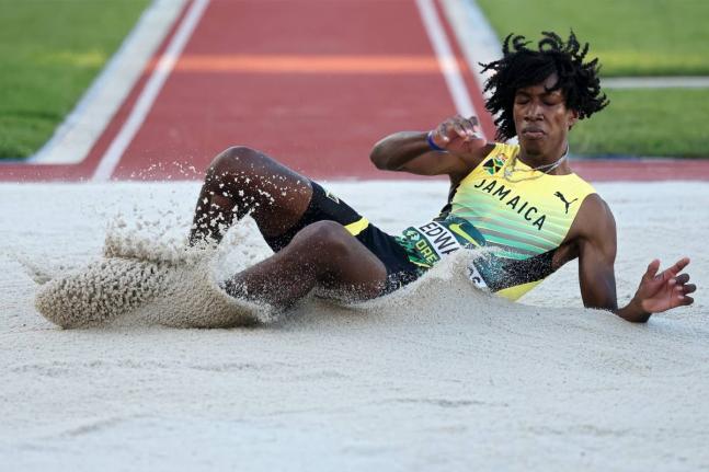 Jamaica's Michael Andre Edwards hits the sandpit during the triple final at the World Athletics Under-20 Championships at the Hayward Field in Eugene, Oregon yesterday.