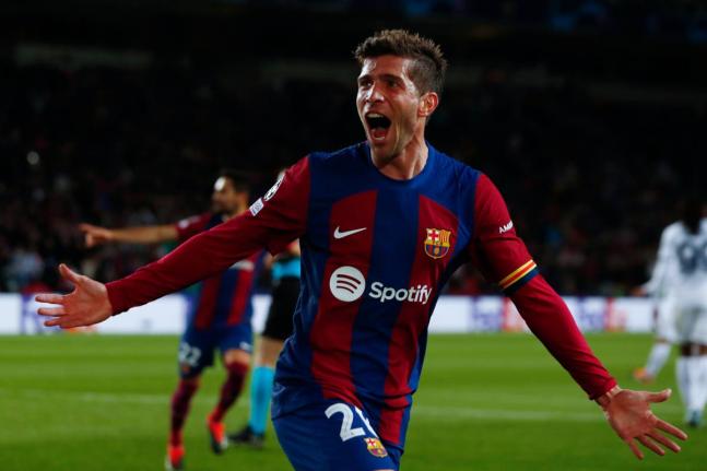 AP 
Barcelona’s Sergi Roberto celebrates his side’s third goal scored by Barcelona’s Robert Lewandowski during the Champions League, round of 16, second-leg football match against SSC Napoli at the Olympic Stadium in Barcelona, Spain, March 12, 2024.