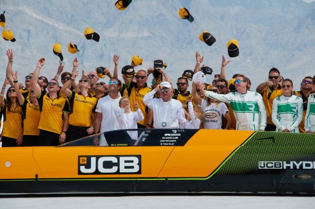 British driver Andy Green (centre) and the JCB engineering team celebrate setting a new land speed record for a hydrogen-powered vehicle at the Bonneville Salt Flats in Utah, yesterday.
