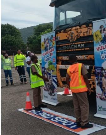 Students of Rollington Town Primary School in Kingston participate in a Vulnerable Road User Initiative hosted by Caribbean Cement Company Limited at the school, on June 17.