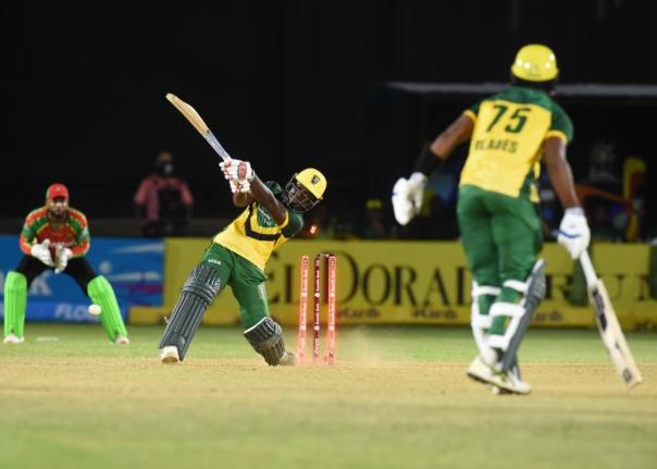 Jamaica Kingsmen's Vitel Lawes (left) has his stumps uprooted in the final over of their Republic Bank Caribbean Premier League cricket game at Sabina Park earlier tonight. 