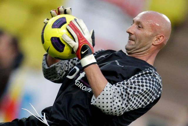 French goalkeeper Fabien Barthez warms up before a charity match between Olympique Marseille and Manchester United, Tuesday, August 2, 2011, in Monaco stadium. 