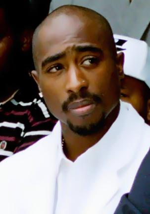 Rapper Tupac Shakur attends a voter registration event in South Central Los Angeles, August 15, 1996. 