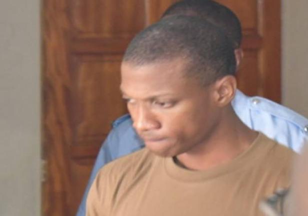 Policeman Joshua Hamlet, who is charged with murder, leaving a magistrate court in Roseau, Dominica on August 17, 2026.  