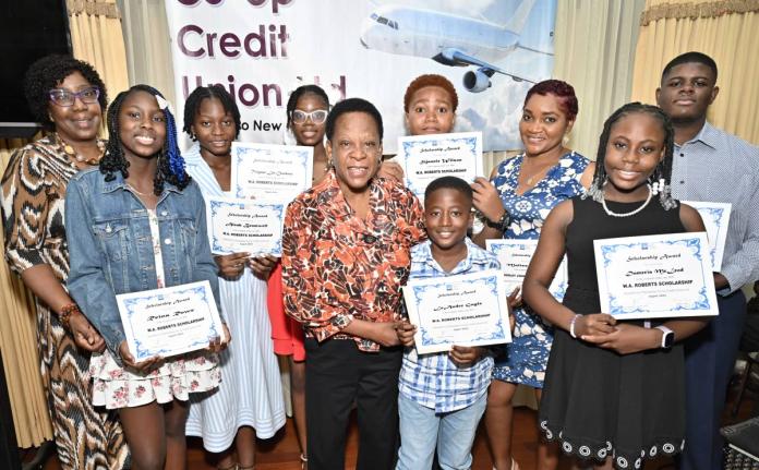 Dr Maxine Wilson (left), general manager of Palisadoes Credit Union, and Celay Harwood-Gayle (centre), president of Palisadoes Credit Union, pose with scholarship recipients after presenting scholarships at the Palisadoes Co-operative Credit Union 2026 Sch