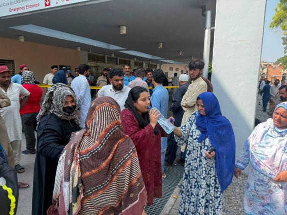 Relatives of the children who died in a hospital fire gather at the hospital in Islamabad, Pakistan, on Wednesday. - AP photo