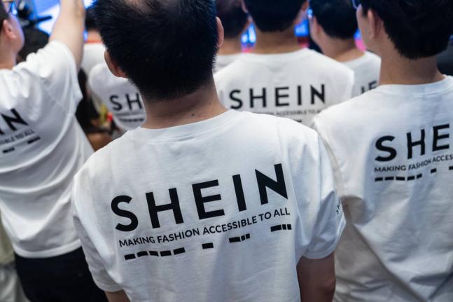 A logo of fast-fashion retailer Shein is seen on T-shirts at the listing ceremony in Hong Kong on Tuesday, September 1. AP 