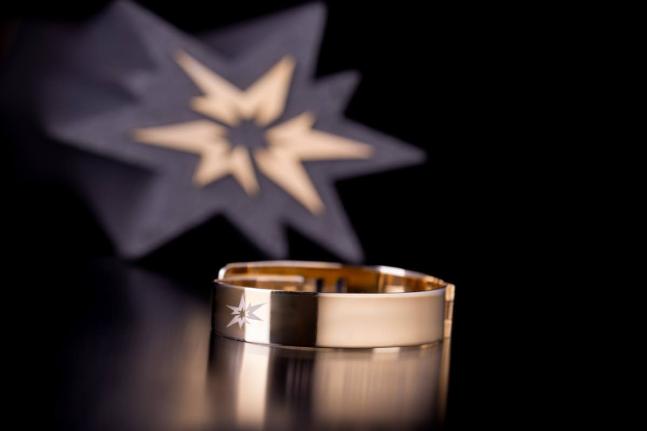 An image of the World Ultimate Championships trophy and bracelet.