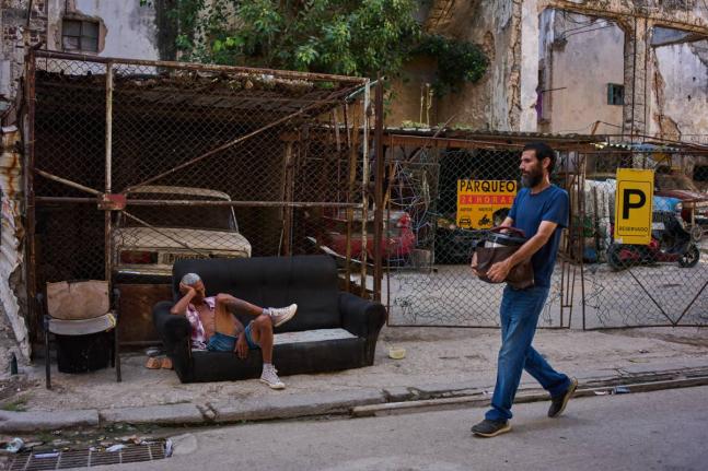 A man rests on a sofa on a street in Havana, Cuba, Thursday, Aug. 27, 2026. (AP Photo/Ramon Espinosa)