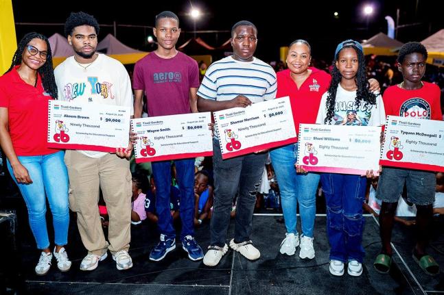 From left: Danielle Insang (left), brand marketing lead at CB Foods, with scholarship recipients Akeem Brown, Wayne Smith, Shamar Morrison, Shani Williams, Tyquon McDougall and Samantha Fisher (third right), assistant brand manager at CB Foods.
