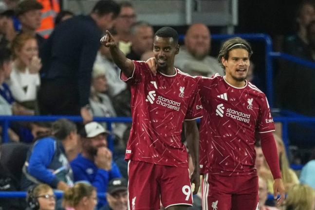 Liverpool’s Alexander Isak celebrates with Milos Kerkez (right) after scoring during the English Premier League match between Ipswich Town and Liverpool in Ipswich, England yesterday.  