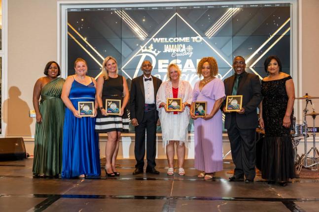 Trudi Davidson (left), cruise tourism manager, Jamaica Vacations Limited (JAMVAC); Lloyd Barnett Jr (fourth left), chairman; and Joy Roberts (right), executive director, join members of the 2025 Top Five travel advisors for a photo opportunity at the Regal