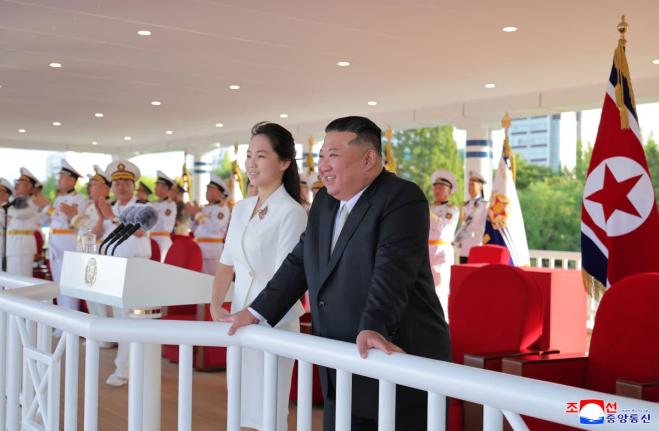 In this photo provided by the North Korean government, its leader Kim Jong Un and his daughter attend a commissioning ceremony of a destroyer, Kang Kon at a port in Wonsan, North Korea Sunday, September 6.