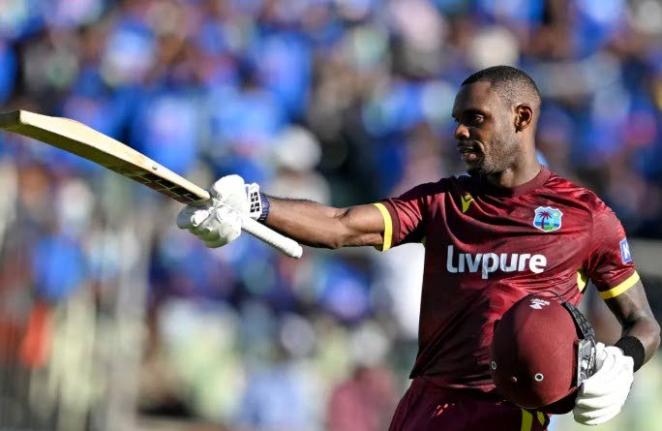 West Indies batsman Justin Greaves celebrates scoring his maiden Test century, in the opening cricket match of the One Day International Series on Sunday, September 27, 2026.
