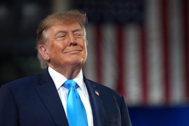 US President Donald Trump arrives to speak at a campaign rally at Truist Arena at Northern Kentucky University. 