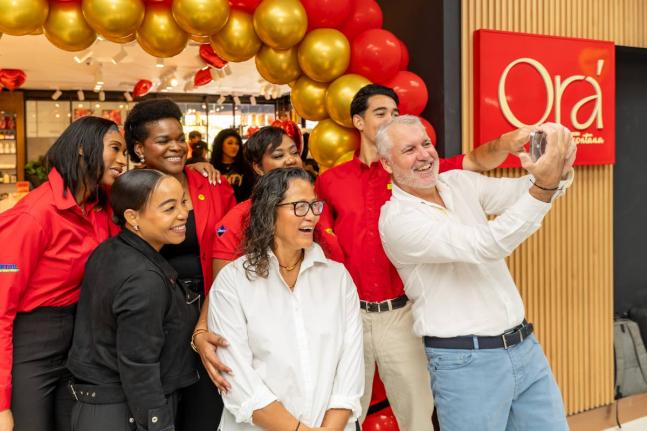 
Fontana CEO Anne Chang, in white, with stakeholders at the opening of Ora by Fontana at Sovereign Centre in St Andrew in 2025.