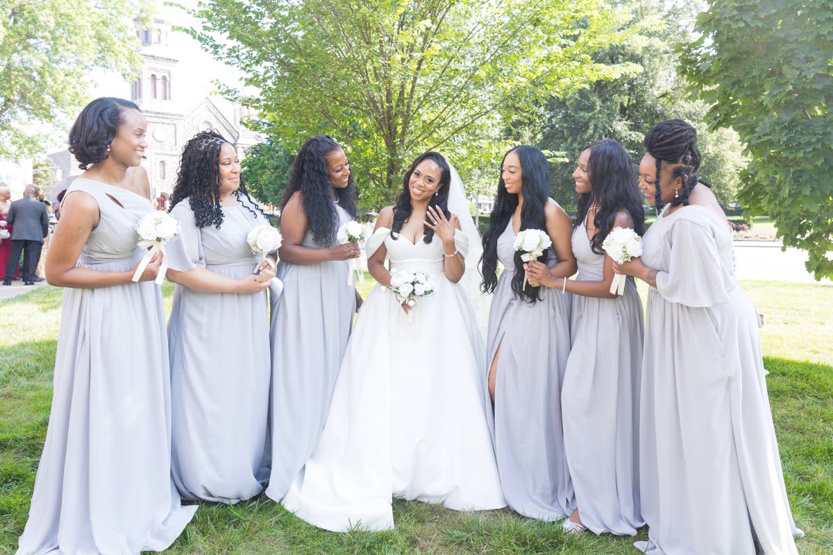 The bridal party swoon over their beloved Yvonne, (from left), Kiondra Sampey; Asheley Ollennu, sister of the groom; Debra Evans, maid of honour; Makenna Waller, co-maid of honour and daughter of the bride; London Carroll and Chinara Anderson.