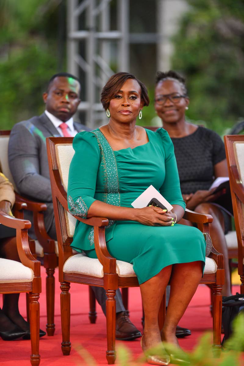 Juliet Holness, the wife of Prime Minister Andrew Holness and member of parliament-elect for St Andrew East Rural, is the picture of grace in a jewel-toned, asymmetrical-neckline emerald dress, accentuated with delicate sleeve embellishments.