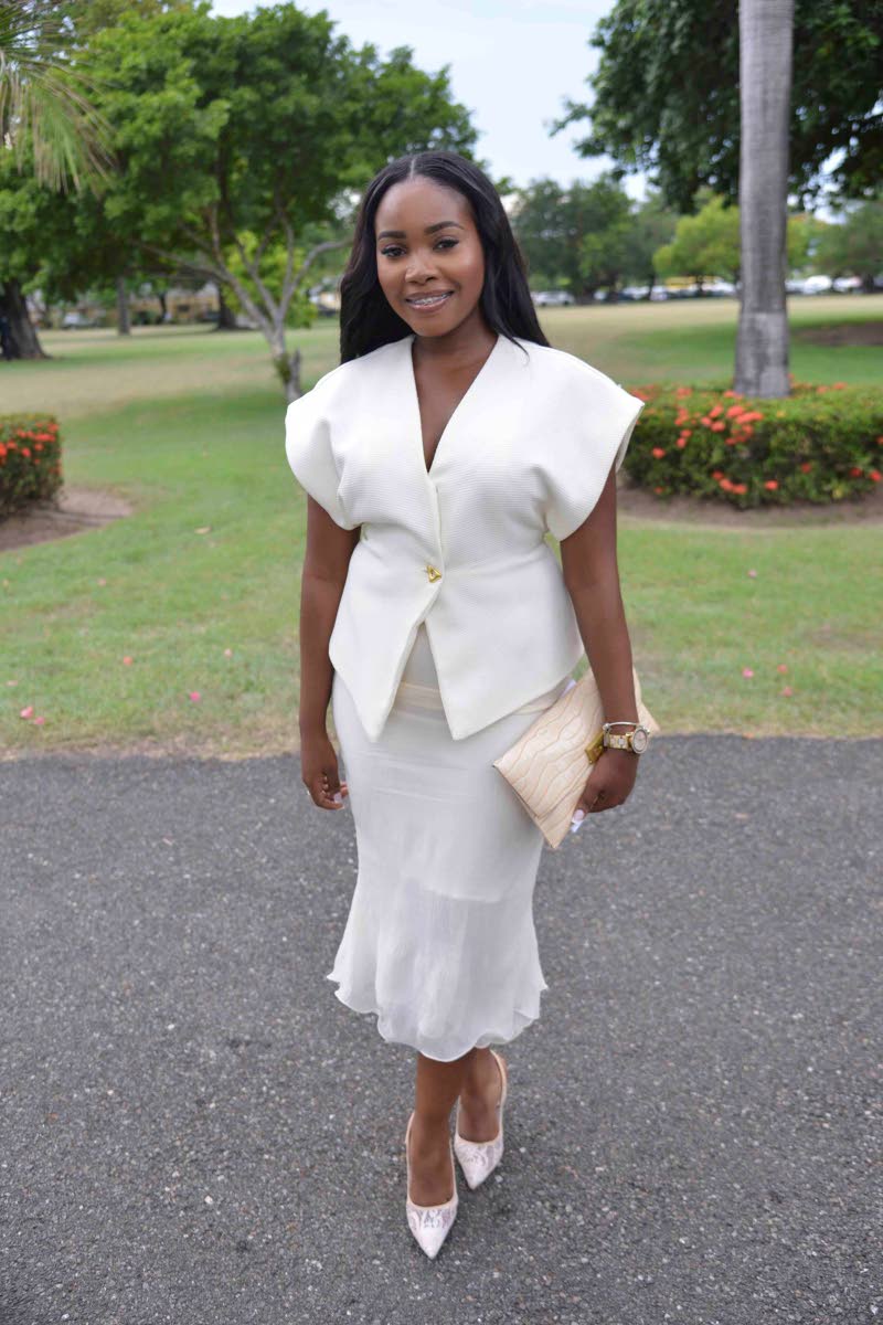 Nickeria Smickle, chief executive officer of A-List Marketing and Entertainment Group, radiates sophistication in a crisp all-white ensemble – a structured top with statement sleeves, paired with a fluted skirt. Polished heels and a neutral clutch sealed