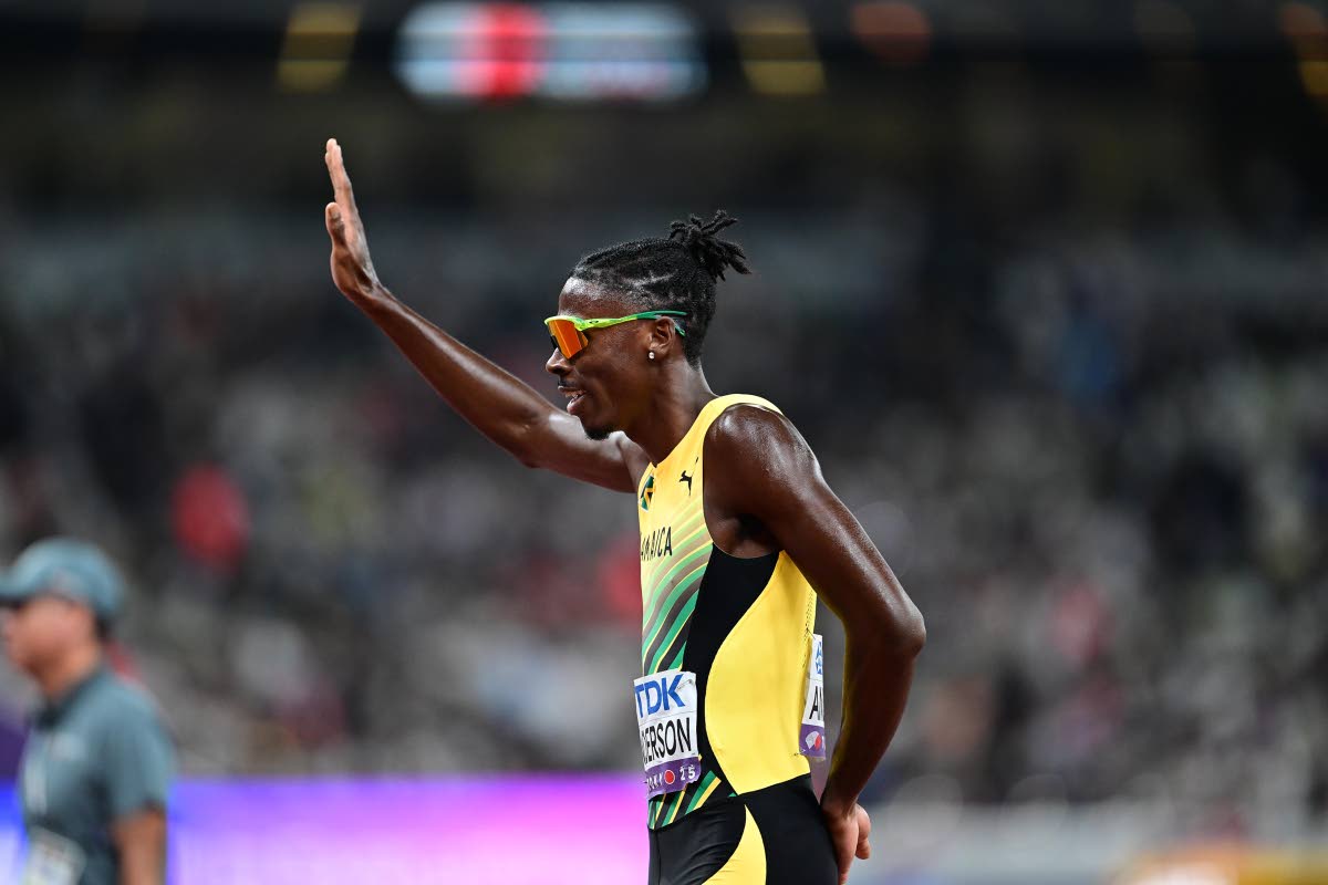 left: Navasky Anderson waves to fans after a valiant effort in the 800-metre final at the World Athletics Championships in Tokyo, Japan left him seventh with a national record of 1:42.76.