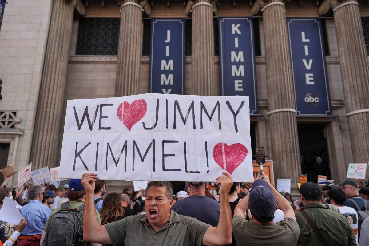 Oscar Villanueva holds a sign outside the El Capitan Entertainment Centre in Los Angeles last Thursday, where the late-night show Jimmy Kimmel Live! is staged.