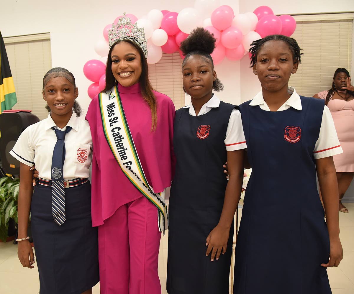 Afiya Birch-Gentles (second left) poses with a few students from Bridgeport High School (from left) Kaycia Harriott, Dejanique Campbell, and Jayda Campbell, during the project launch of Beauty Beyond Brushes held last Friday at the Portmore City Municipali