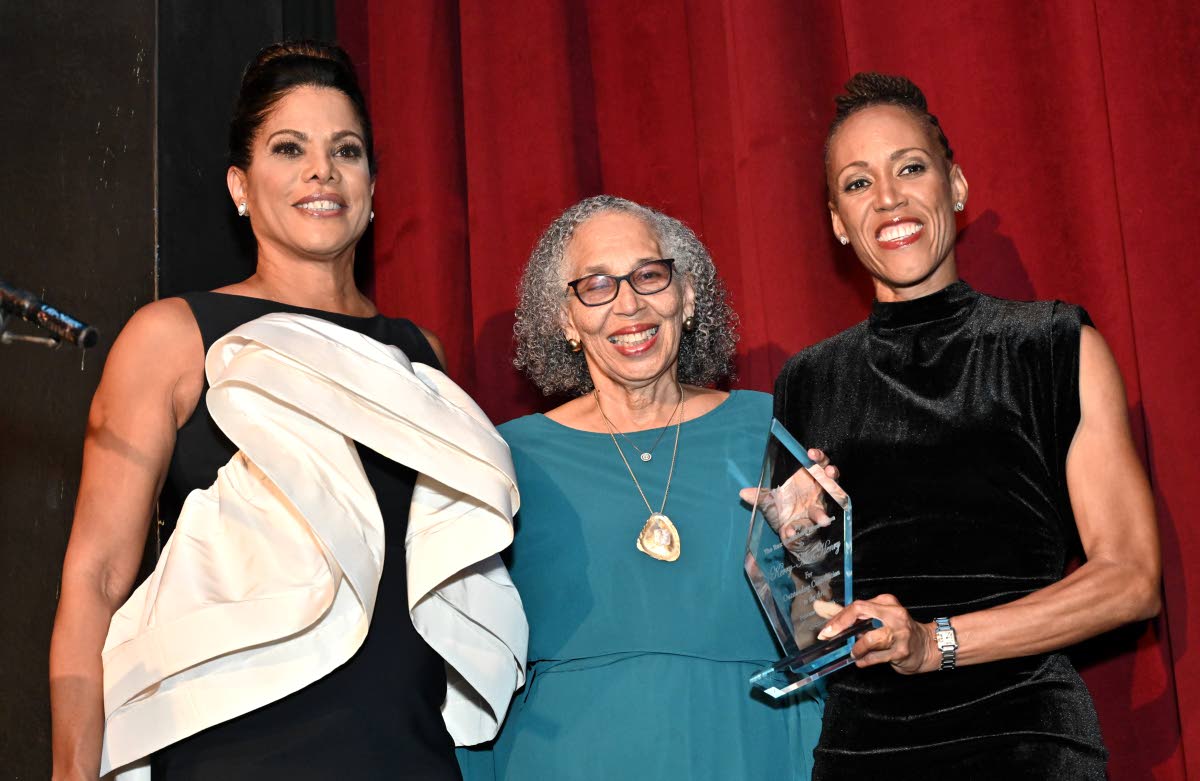 Kerry-Ann Henry (right) received the Rex Nettleford Award for Outstanding Contribution to the Arts from Elizabeth Buchanan-Hind (left), executive director of Rex Nettleford Foundation, and Justice Hilary Phillips during the Remembering Rex annual celebrati