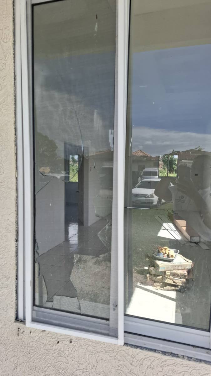 A shattered window on the steel-frame building, the only damage which the model house sustained.