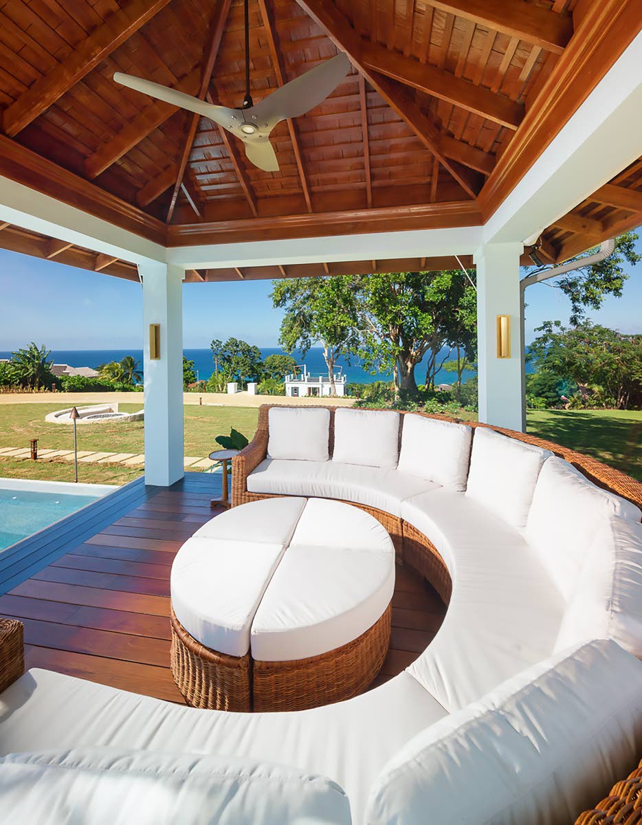 
One of two poolside gazebos, featuring stunning custom furniture.