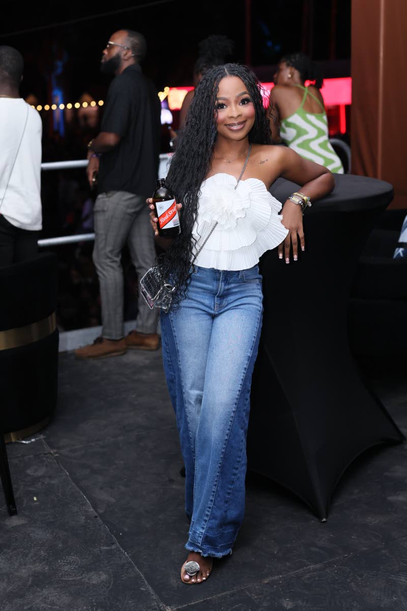 Keeping it chill yet cute for the occasion, Hanna Turner, junior brand manager at Red Stripe, poses with her drink of choice for the night.