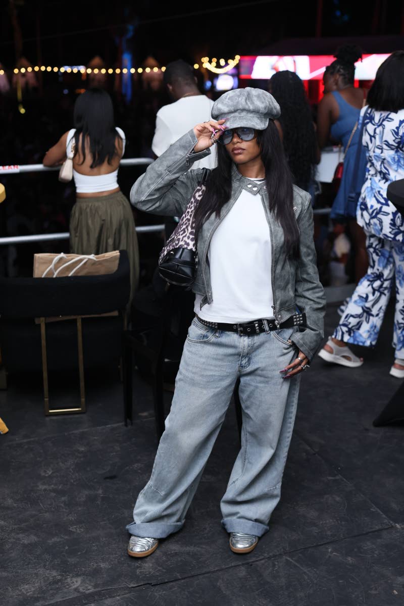 Content creator Chenel Lee completes her look with a retro-inspired newsboy cap.