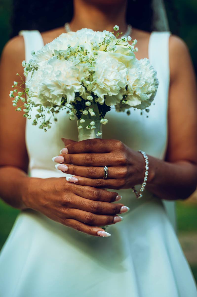 Kady-Ann’s wedding dress, simple yet elegant, was from Odd Muse London and complemented by a bouquet of hydrangeas, baby’s breath, and white roses.