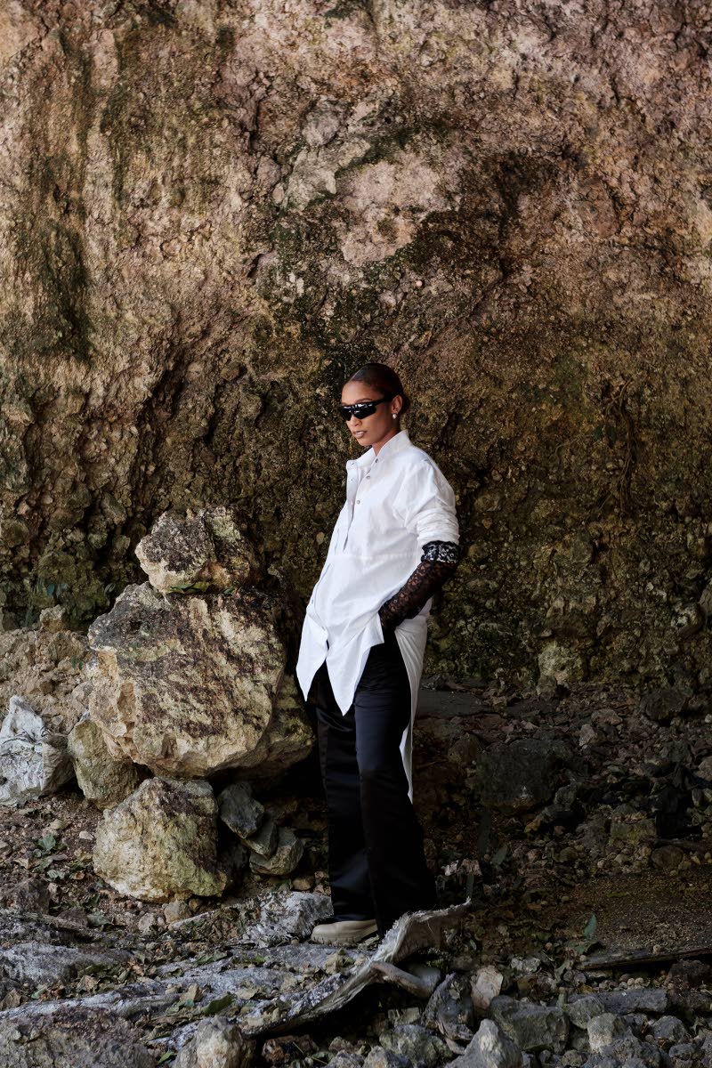 This long-sleeve white cotton shirt, defined by golden table-stitch inseam accents, is given a clean, modern and edgy look with the Mandarin collar and coconut shell button closure. 