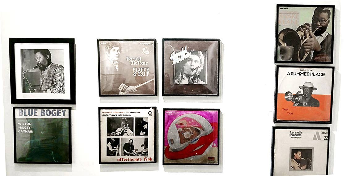 Album covers highlighting the contribution of Caribbean musicians and their descendants to British cultural life, on display at the Windrush: The Midwife of Modern Britain exhibition at the Jamaica Music Museum Water Lane Gallery.