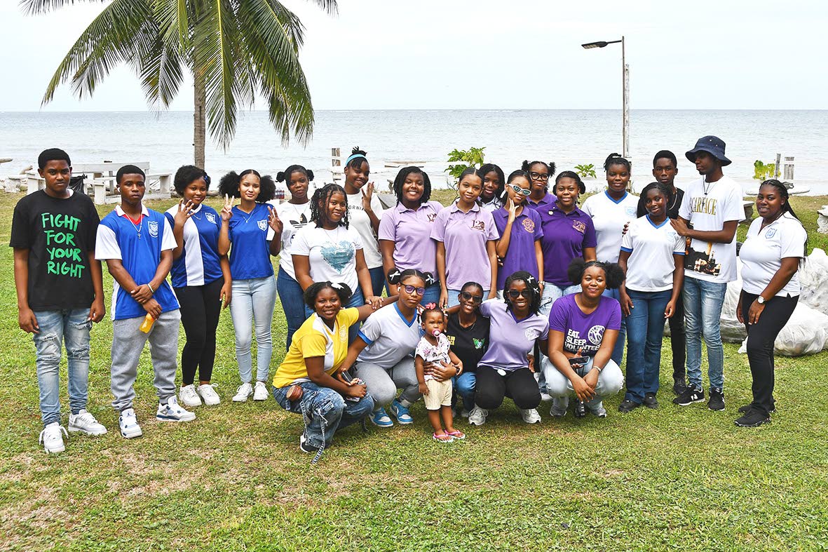 Key Club members from Iona High School and St Hilda’s Diocesan High School pose for a photograph during the Roxborough Beach clean-up. Included are Tara-Jo Ferguson Vassell, a teacher at Iona High School (standing, right), and Amoya Williams, lieutenant 