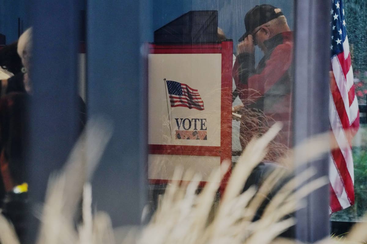 A voter casts a ballot on the first day of early voting in Minnesota at the Elections & Voter Services building on September 18, 2026, in Minneapolis. 