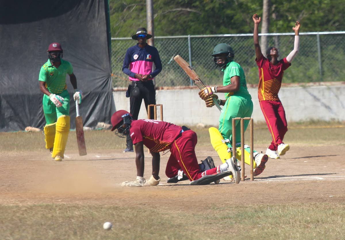 St Catherine CA bowler Ranjay Thomas throws his hands in the air as the ball evades wicketkeeper Amanjah Morris during the JCA Super 50 Cup match at Port Esquivel at the weekend. Also watching the action are  Clarendon CA batsmen Teino Osbourne and Justin 