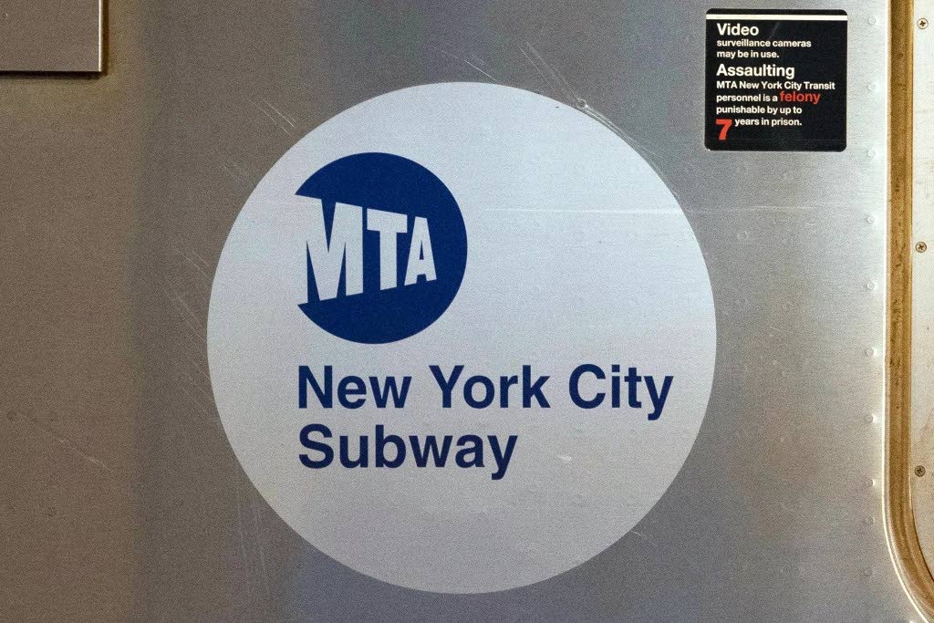 The MTA logo is seen on the side of a New York City subway car, April 23, 2020, in New York. 