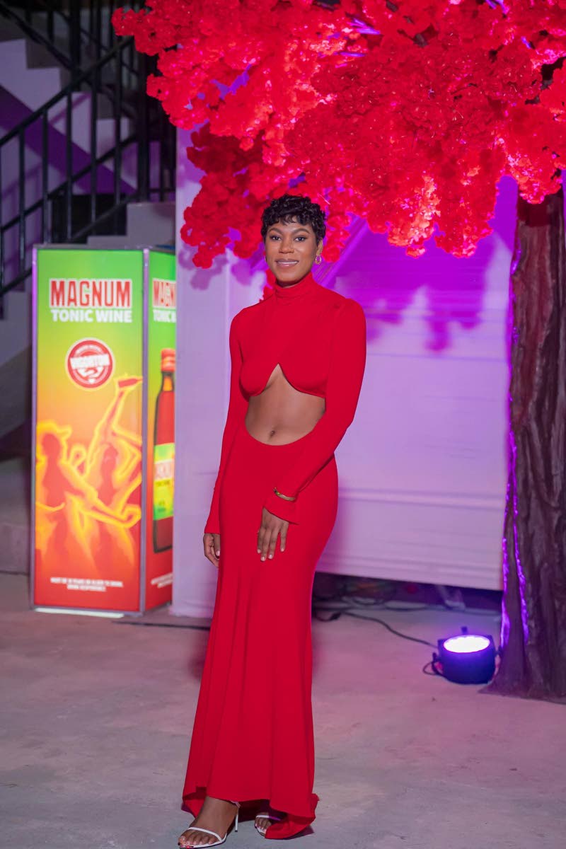 Latoya Hanson, director at Millionaro Holdings, swipes right on a figure-hugging dress that perfectly complements her silhouette. 