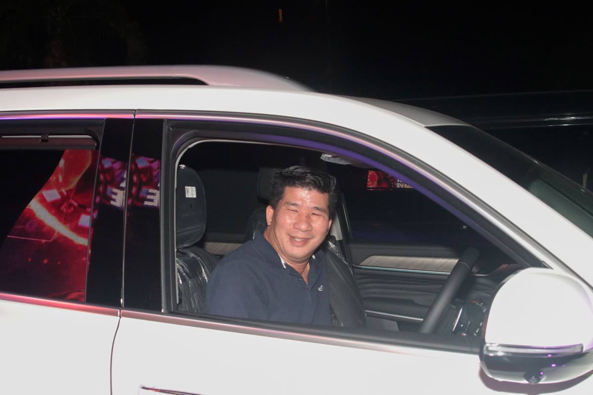 Grand prize winner Oliver Chang sits in his brand-new GWM Tank 500 PHEV, which he won in the Acropolis Gaming Lounge Summer Heatwave promotion.