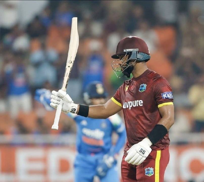 
West Indies batter Shai Hope raises his bat after scoring a century during the third One-Day International against India at the PCA New Cricket Stadium in Tira yesterday. Hope ended unbeaten on 162. 