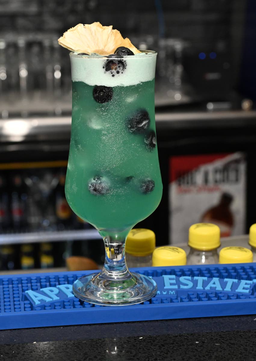The obsession is a cocktail made with pineapple juice, blue curaçao, sweet and sour, and peach schnapps