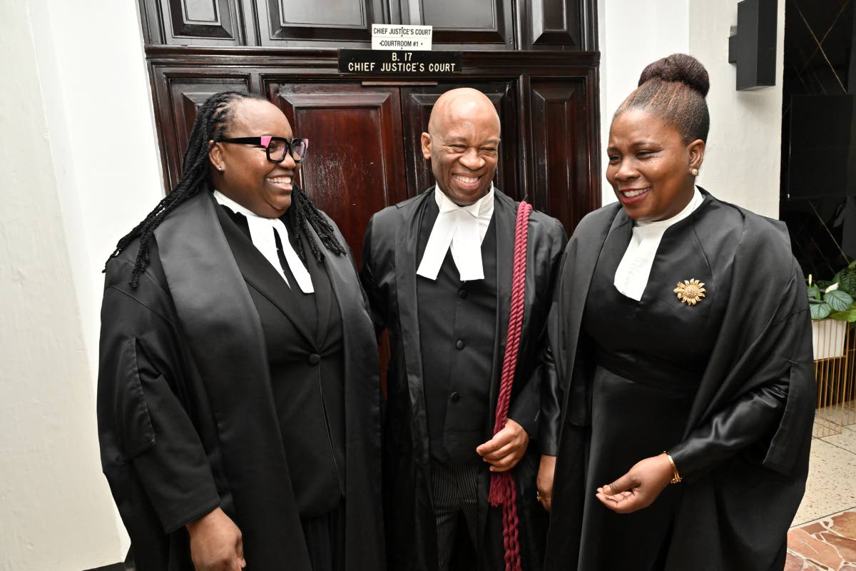 From left: Director of Public Prosecutions Claudette Thompson, KC; Oswest Senior-Smith, KC; and Deputy Solicitor General Lisa White,  KC, share a laugh during a conversation after they were admitted to the Inner Bar during a ceremony at the Supreme Court o