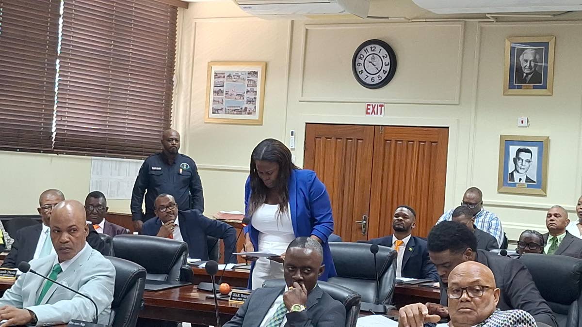 Councillor Tanyalee Williams of the  May Pen North Division reading her declaration, notifying the Clarendon Municipal Corporation of the change in her party affiliation during a special meeting on Friday.